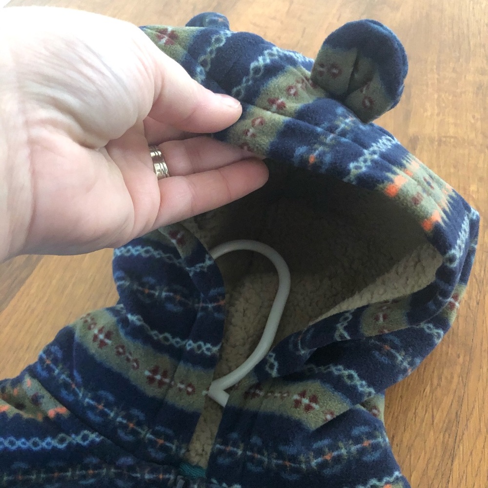 Infant onesie with hood